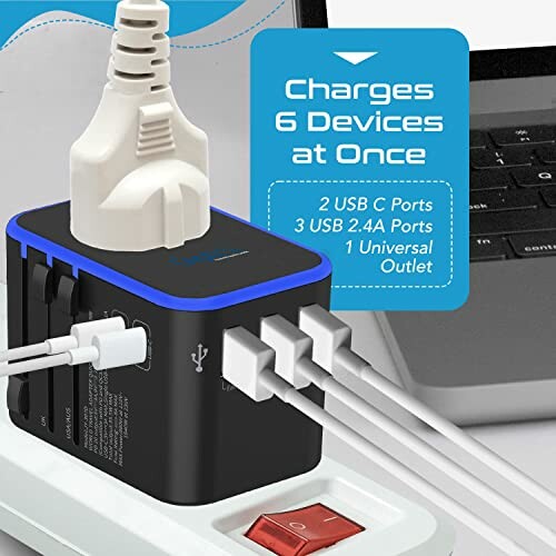 Universal travel adapter with multiple plug types and USB ports.