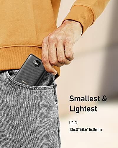 Person placing a compact power bank in their pocket, text reads 'Smallest & Lightest, 106.0*68.6*16.0mm'.