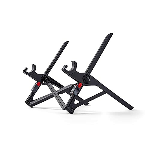 Two foldable guitar stands in black.