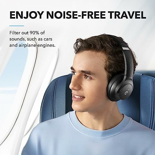 Man wearing noise-cancelling headphones on an airplane.