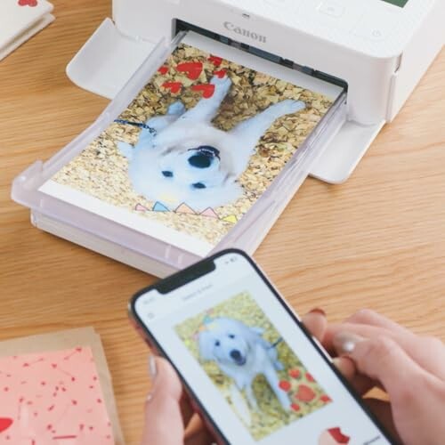 Person using smartphone to print a photo of a dog on a printer.