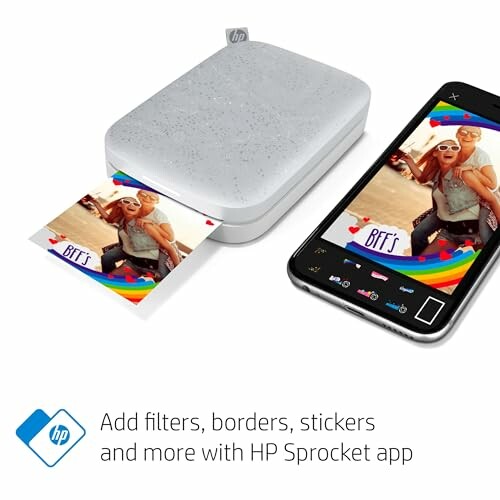 Portable photo printer printing an image from a smartphone.