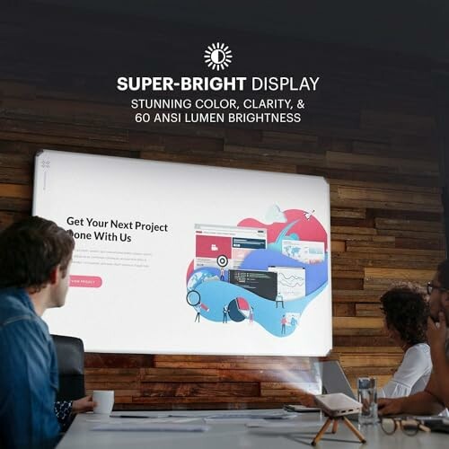 People watching a presentation on a super-bright display.