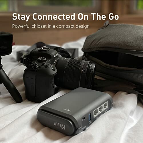 Portable WiFi 6 router with camera and bag on a bed